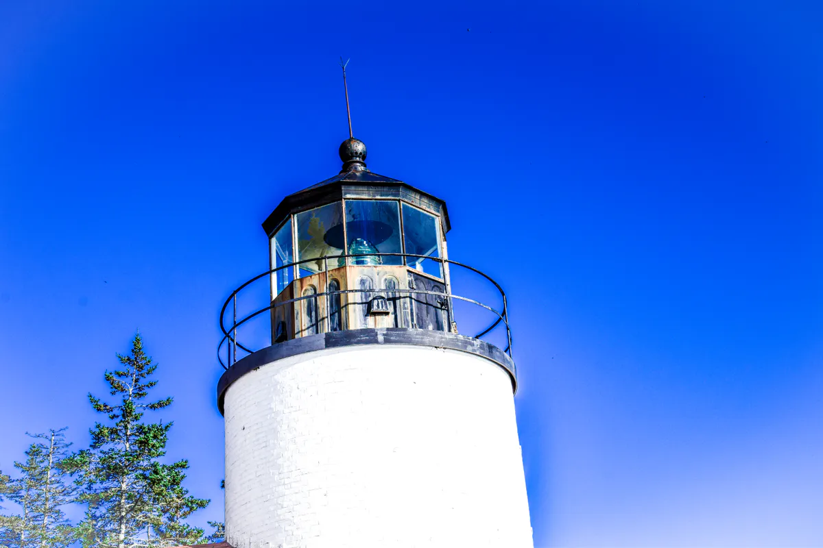 Bass Harbor Head Light on a rocky cliff on the quiet side of Mount Desert Island in Acadia National Park, Maine