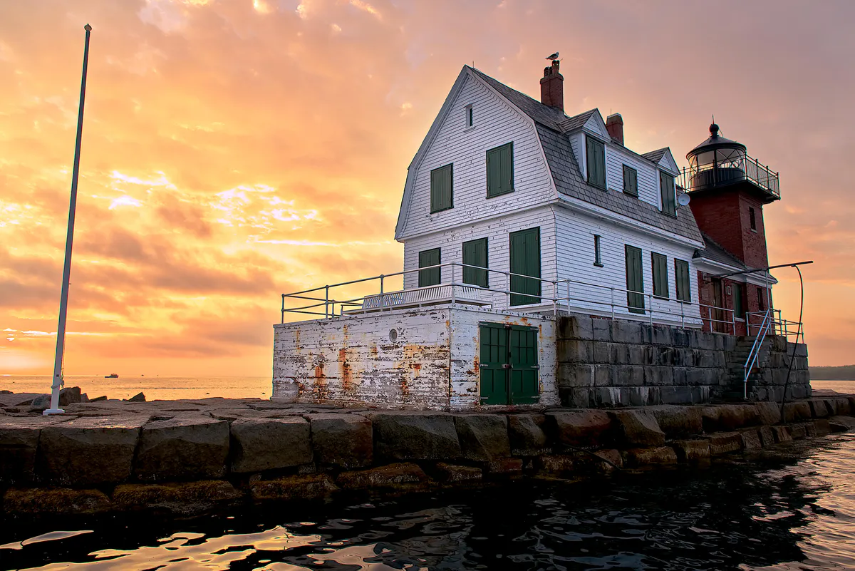 Rockland Breakwater Light at the end of a long granite jetty extending into Penobscot Bay, Rockland, Maine