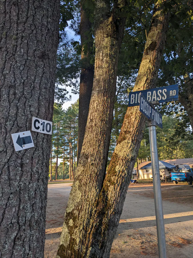 A family campsite at Wassamki Springs Campground in Scarborough, Maine, showing a tent under tree cover