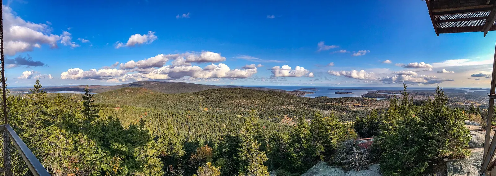 Autumn forest and coast from the Beech Mountain fire tower in Acadia, Maine.